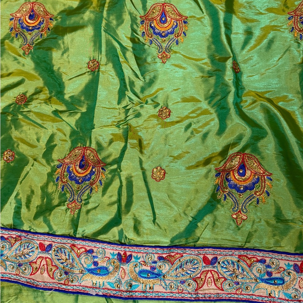 Embroidered Green Saree with Intricate Patterns